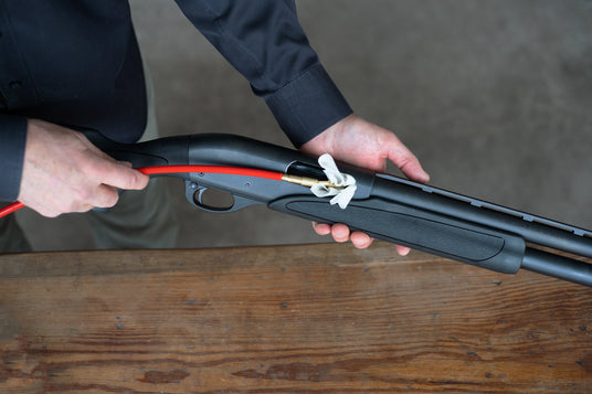 Man cleaning shotgun with Full Blast Flex Rod